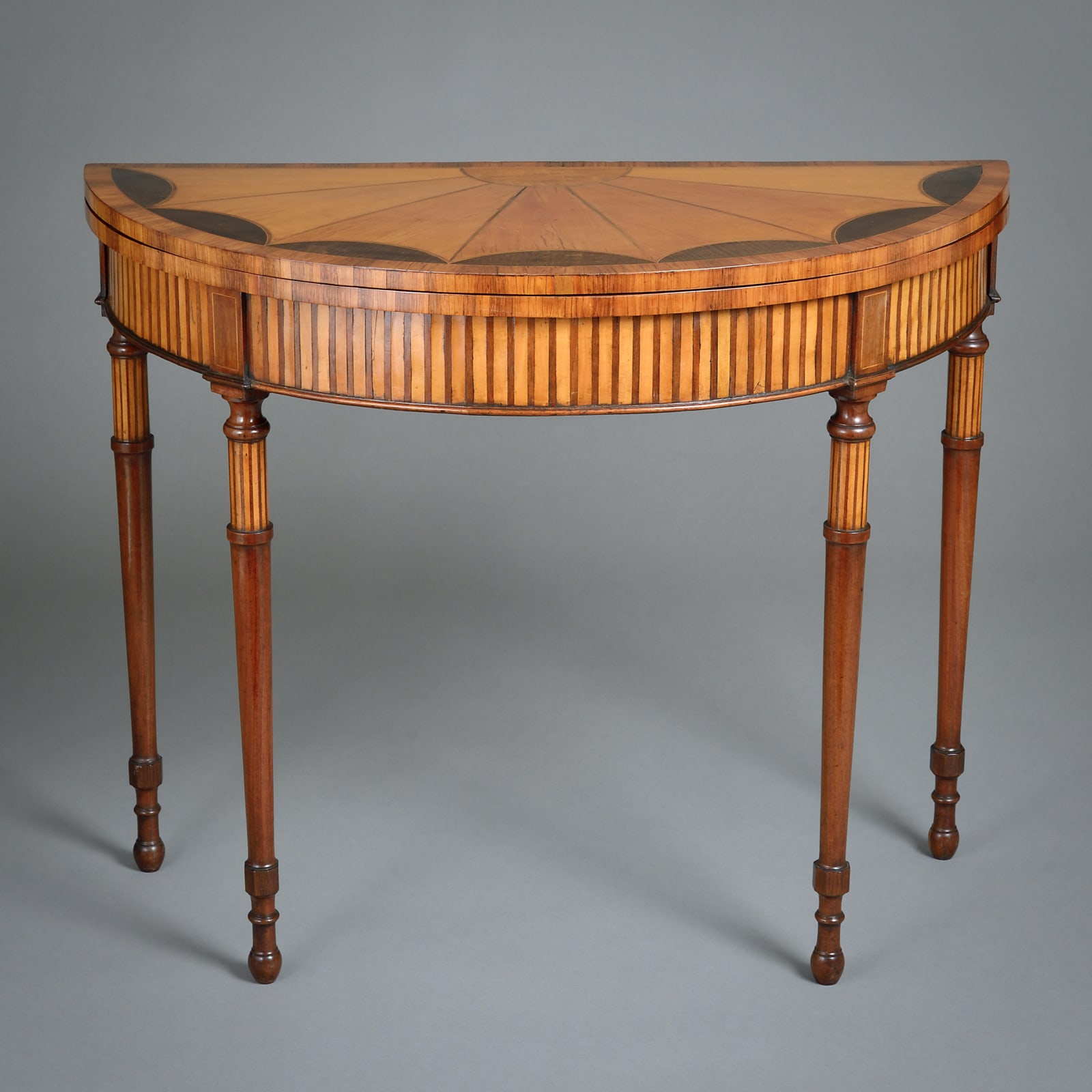 GEORGE III SATINWOOD AND MAHOGANY DEMI-LUNE CARD TABLE