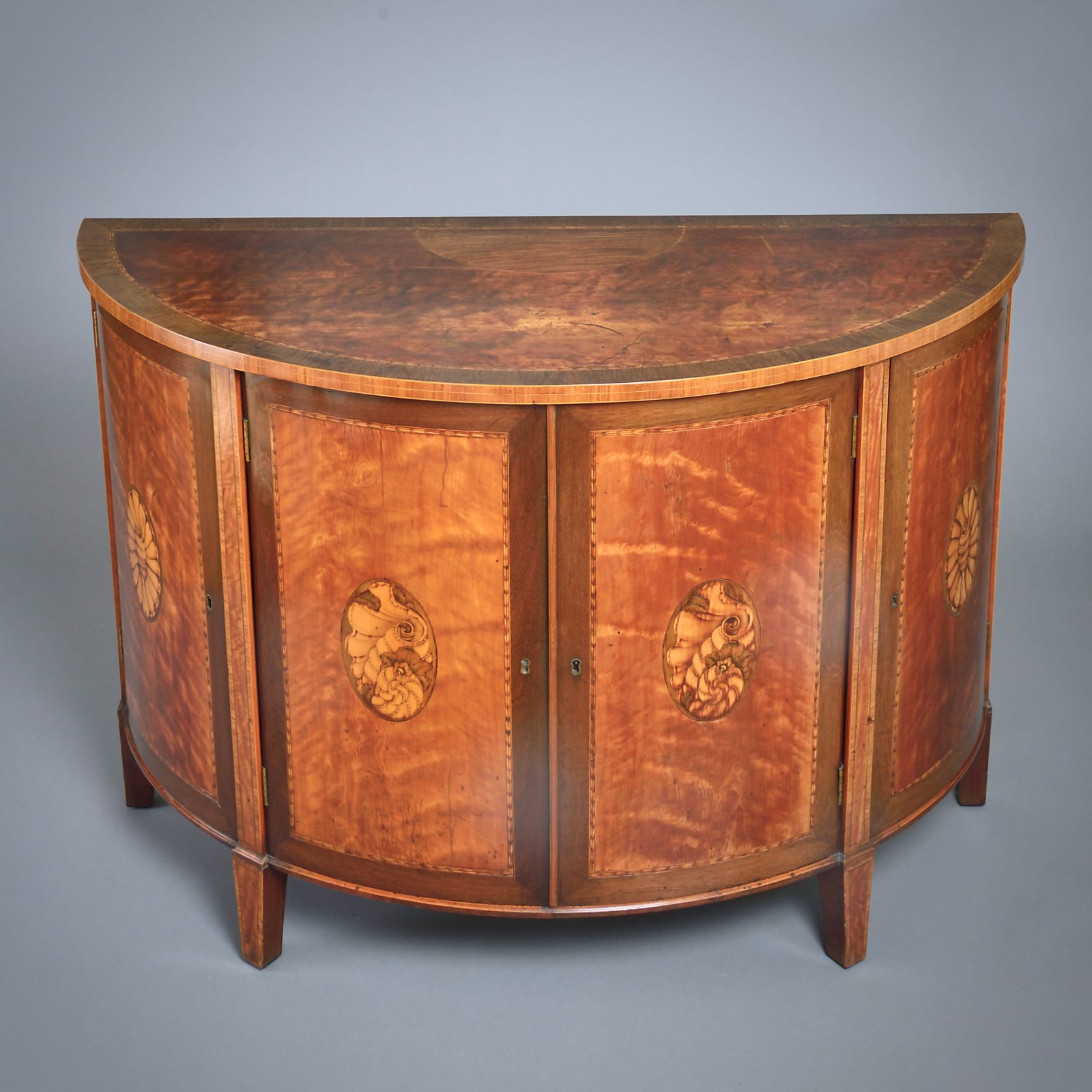 GEORGE III SATINWOOD, AMARANTH AND MARQUETRY COMMODE BY GILLOWS