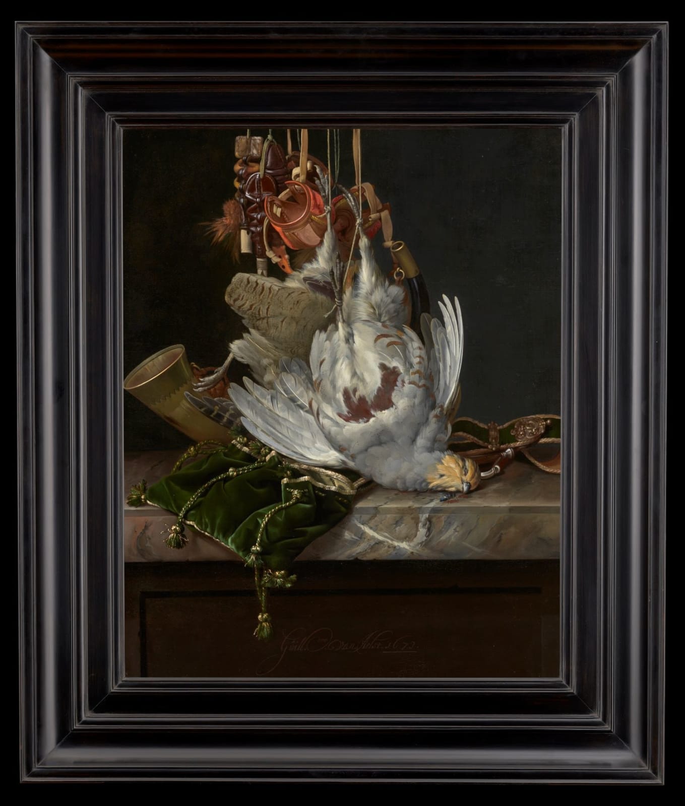 Willem Van Aelst (Delft, 1627 - 1683 Amsterdam), A partridge, a hunting horn, hawking hoods and a gold-trimmed green velvet hunting bag hanging above a marble ledge