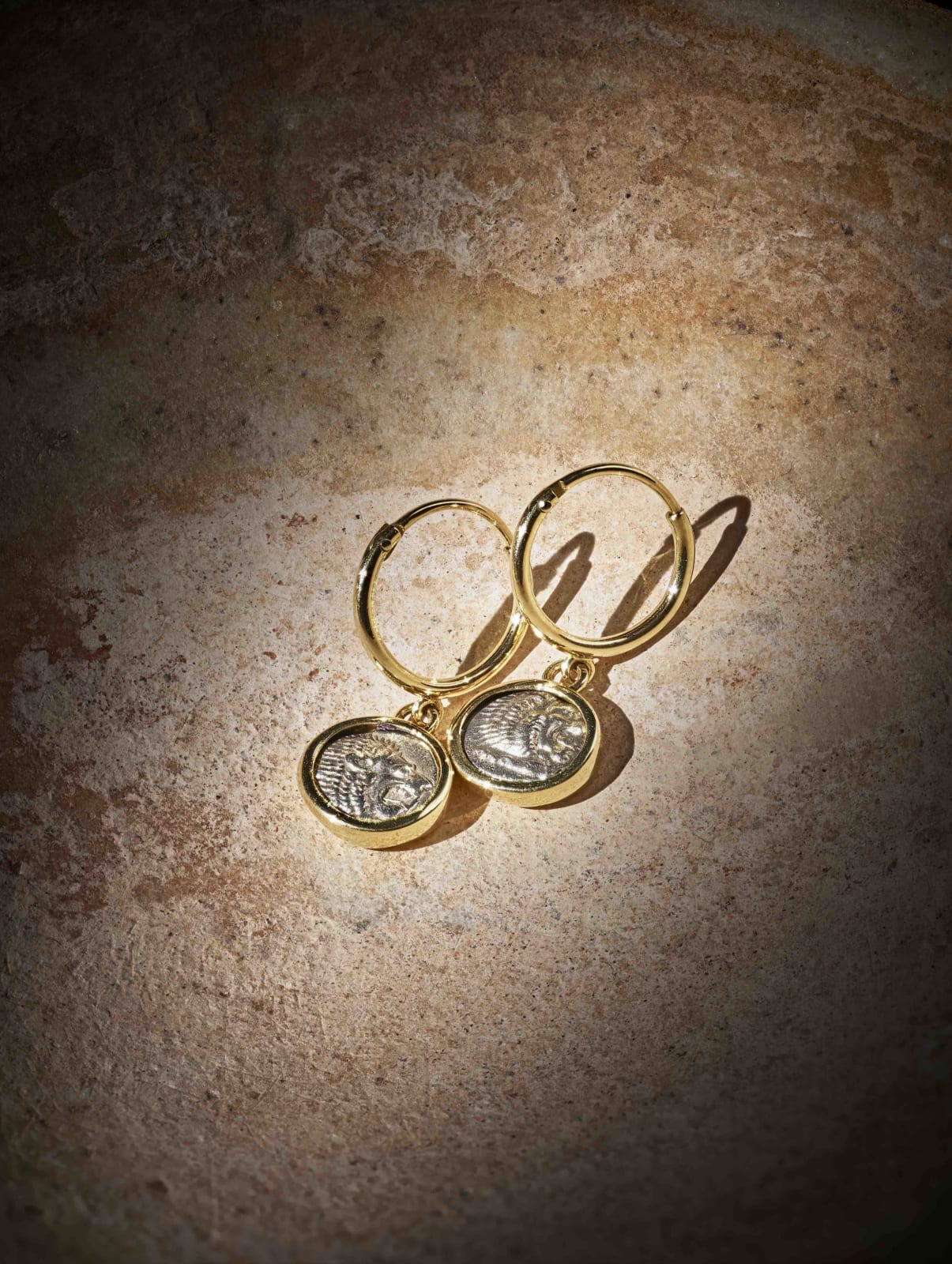 Greek, Miletos lion hoop earrings, late 6th - early 5th century BC