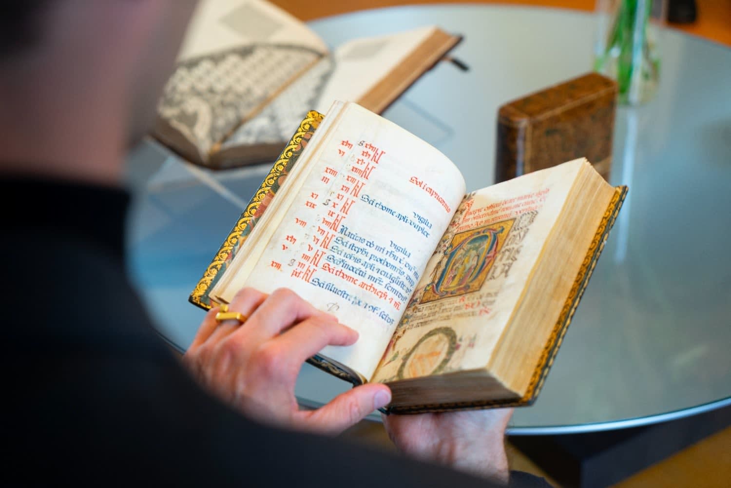 a richly illuminated medieval manuscript, an Italian Book of Hours made in Roma, signed and dated