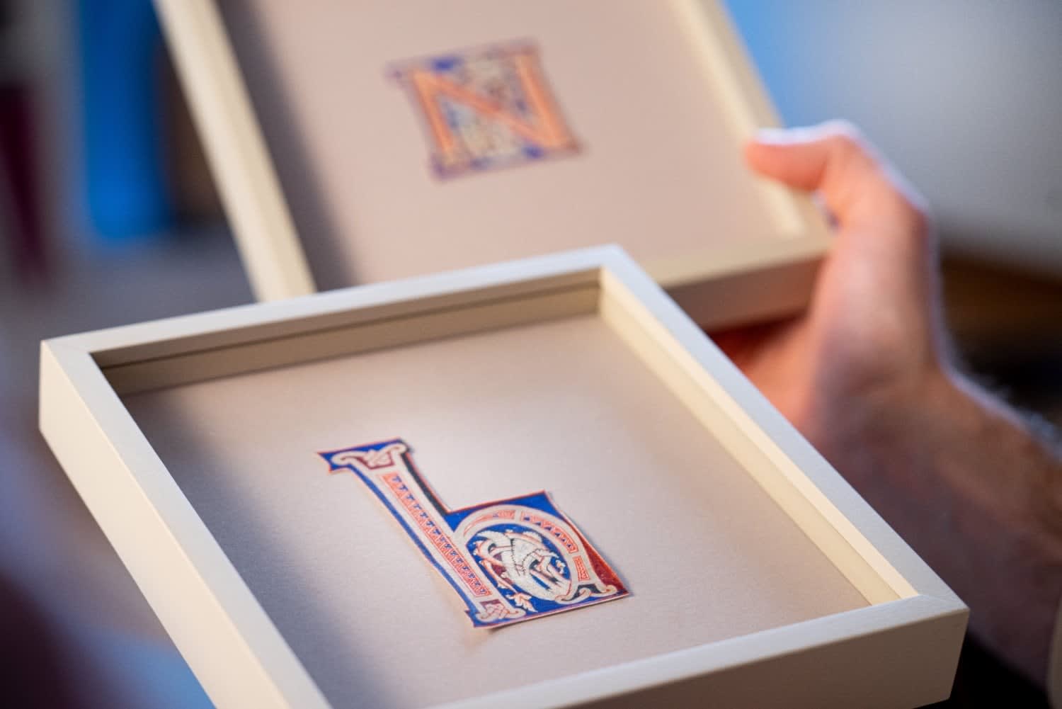 Colorful illuminated iniaitls E, H and N from an Atlantic Bible realized in Tuscany c. 1175.