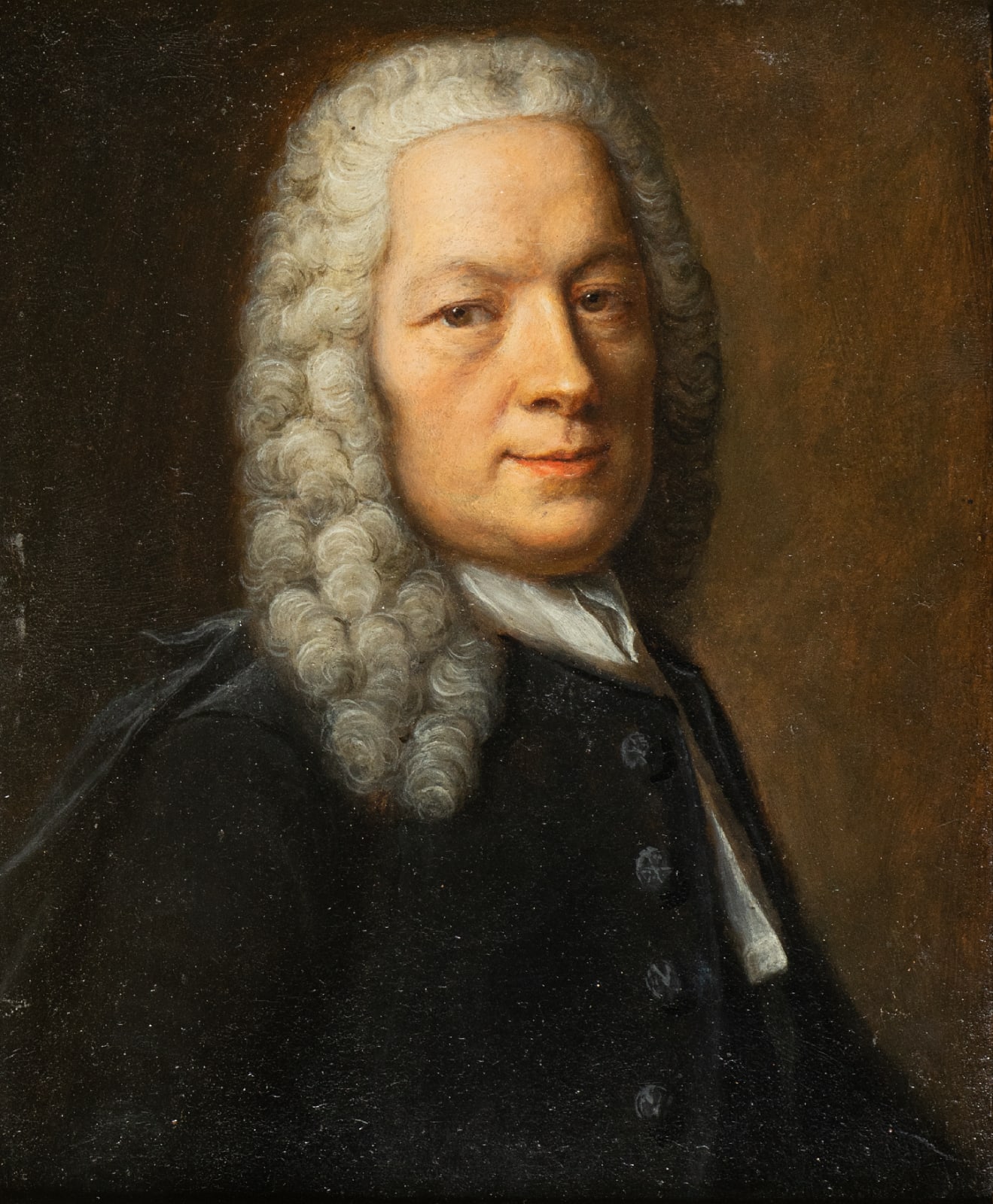 Portrait of a man with curly hair in formal attire and yearing a black coat, set against a dark background, by Robert Gardelle.