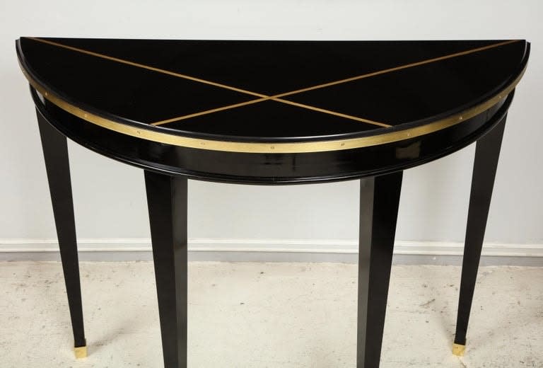 Custom Pair of Ebonized Demilune Consoles with Inlaid Brass Top