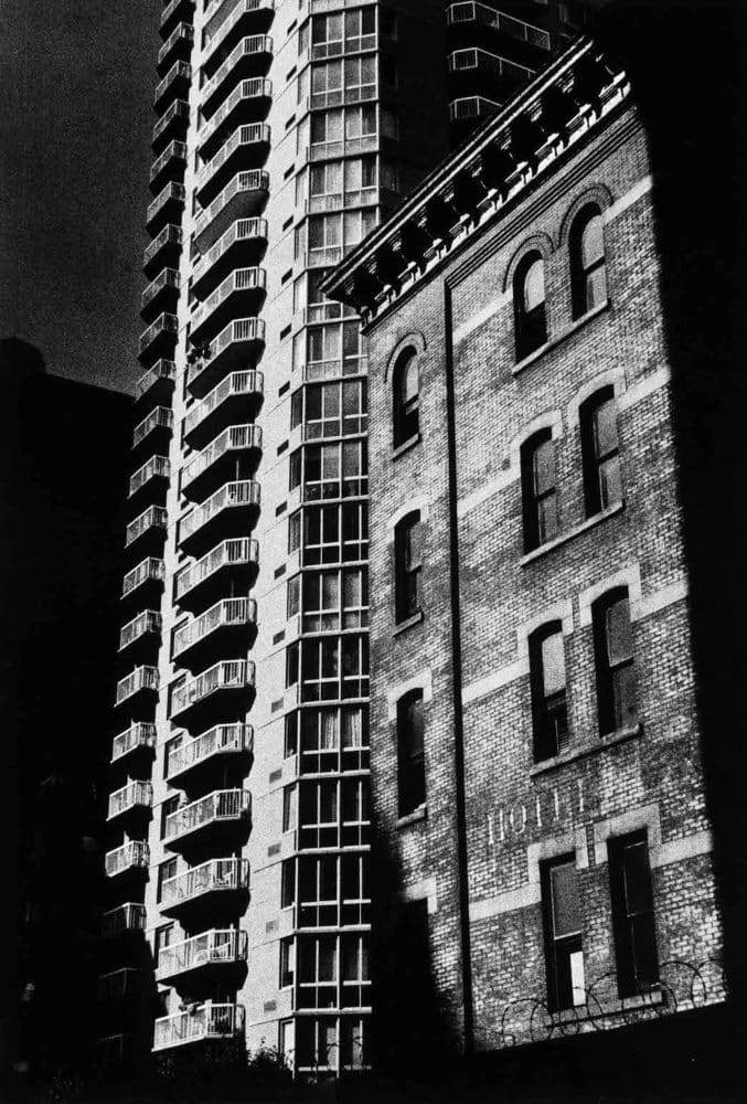 Sid Kaplan, New building to left of old building, East 24th. St. New York City, c. 1990