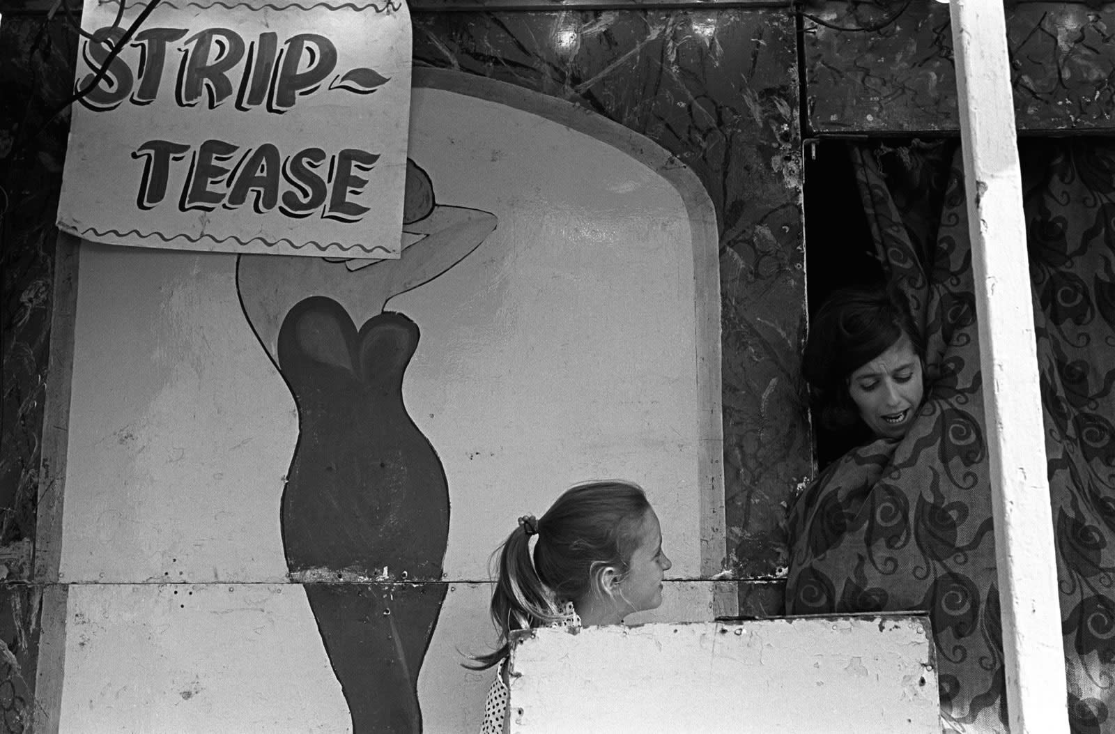 Homer Sykes, Striptease booth, mother and daughter. Derby Day, Epsom Downs, Surrey, 1969