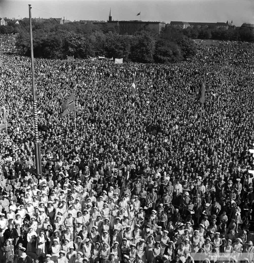 Lee Miller, Public Gathering, Faelledparken, Copenhagen, Denmark 1945 [Farewell to arms, demonstration by disbanding freefighters, Faelledparken, Danish Freedom Council's rally 20th May], 1945