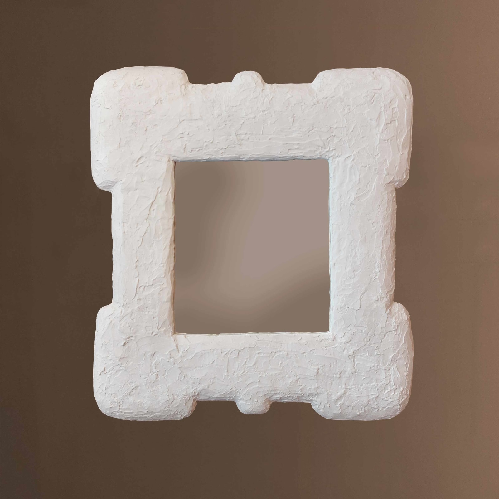 Parham plaster mirror on brown wall