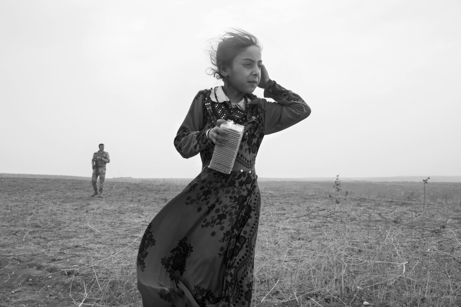 Paolo Pellegrin, Refugees from the village of Buharbuq, near Bashiqa. Told by ISIS that they were to be moved to Mosul the following day, the village residents fled their homes in the middle of the night and took refuge behind Peshmerga lines. Iraq, 2016, 2016