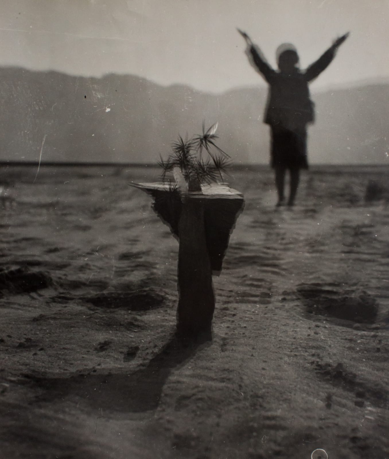 Osamu Shiihara, Untitled (Desert, Table and Woman With Arms Raised)