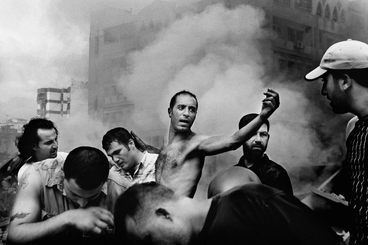Paolo Pellegrin, Civilians sift through the rubble looking for survivors following an Israeli air raid. Beirut, Lebanon, 2006