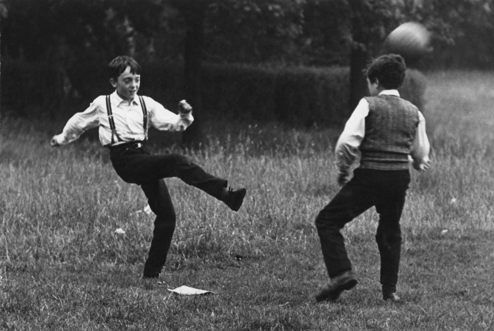 Edward Quinn, A Boy with Braces Kicking a Football, Phoenix Park, Dublin 1963