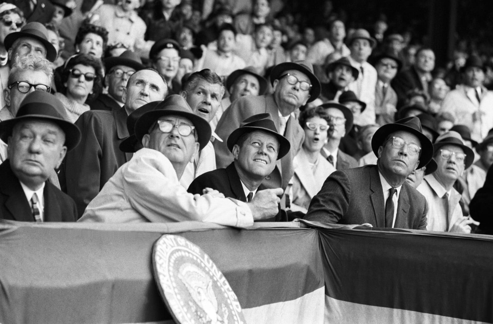 Neil Leifer, United States President John F. Kennedy and Vice President Lyndon Johnson watch a foul ball from the stands during the opening day game of the Washington Senators at Griffith Stadium. Washington, DC, 1961