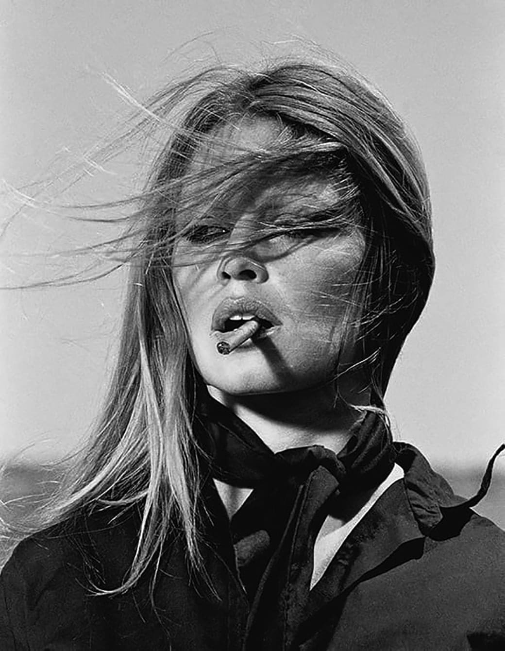 Terry O'Neill, Brigitte Bardot smoking a cigar on the set of Les Petroleuses, 1971
