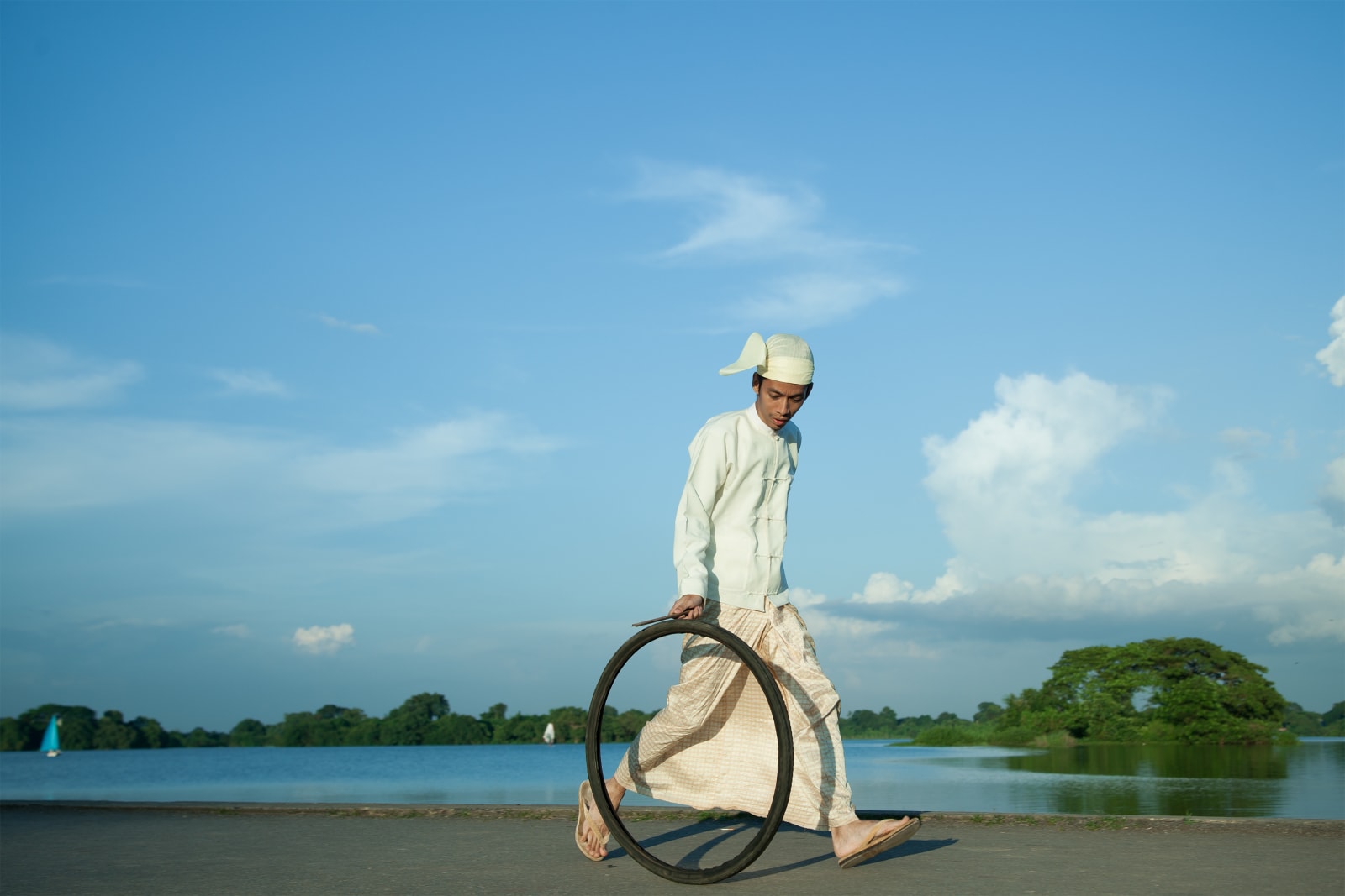 Moe Satt, "The Bicycle Tyre Rolling Event from Yangon”: Innya Lake, 2013