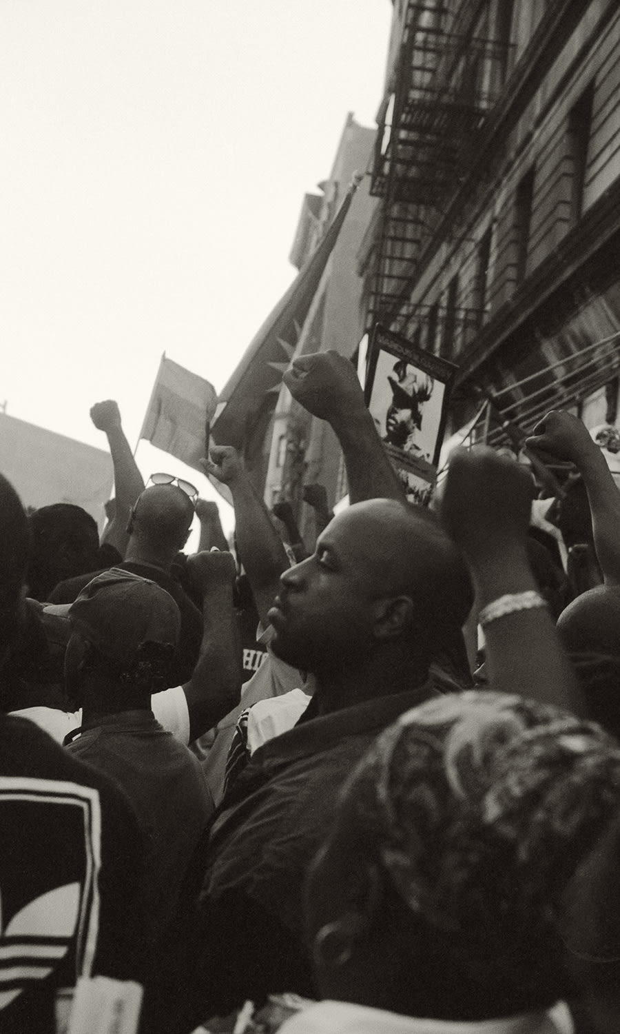 Ming Smith, Million Youth March, Raised Fists (Harlem, New York), 1998