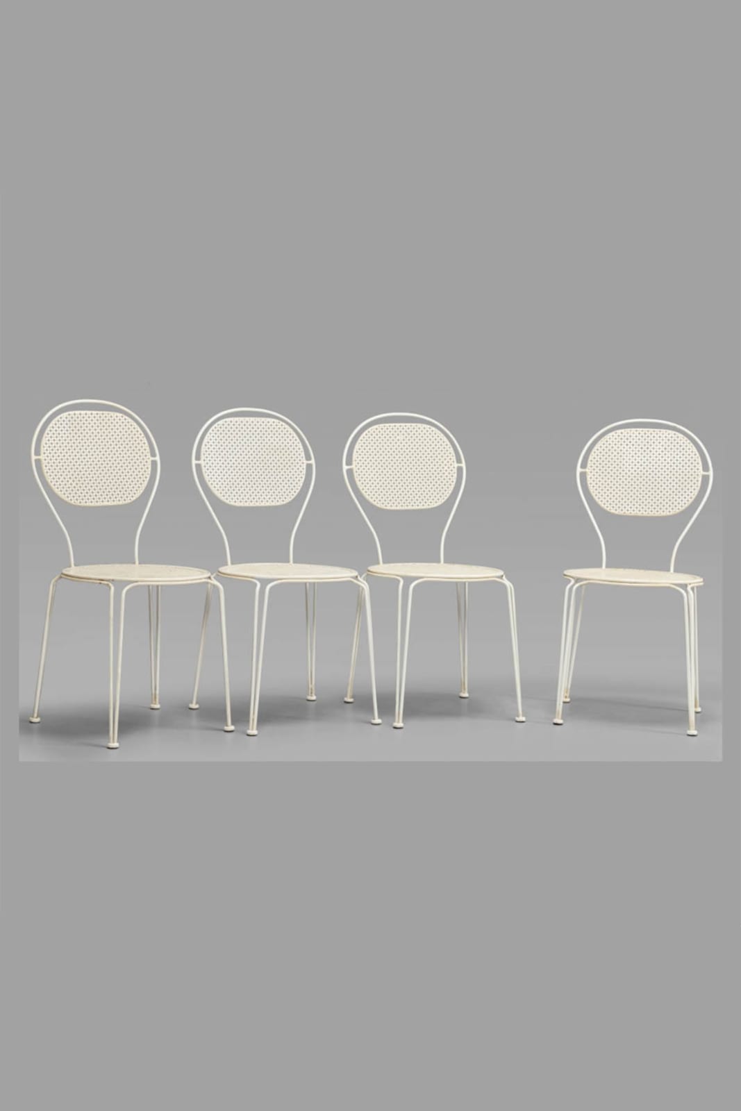 Four Pierced Metal Chairs in the style of Mathieu Matégot
