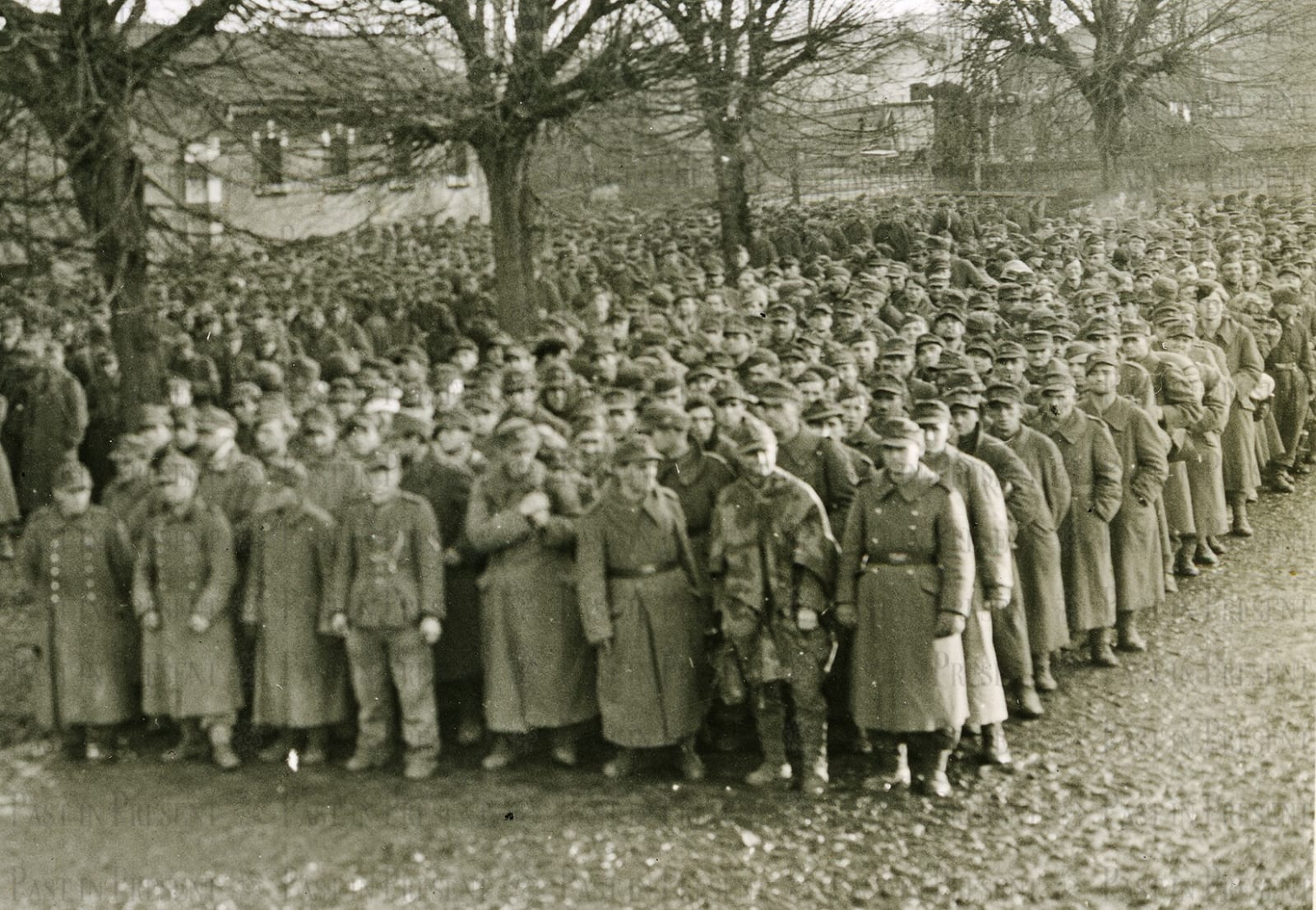 Roland Meade, German prisoners who were captured in Strasbourg being segregated at Epinal stockage into smaller groups for further shipment to rear areas France 11.27.44, 1944