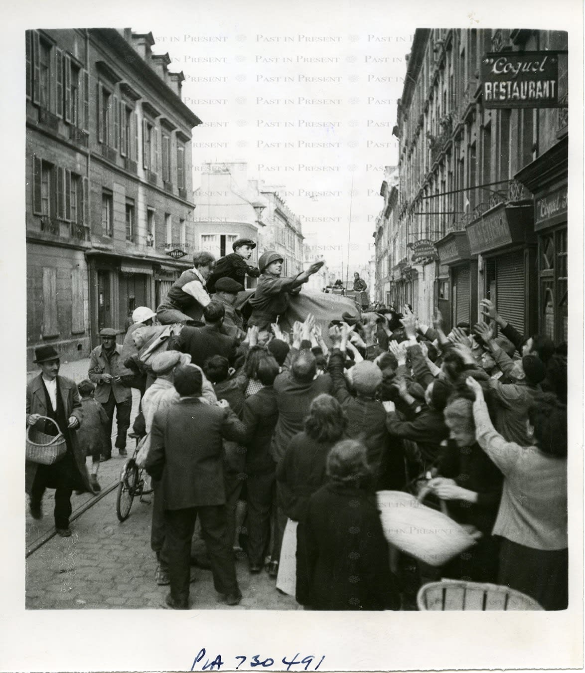 British Official Photo, “For the Sweet Tooth: Liberation and Longing on a French Street”, Caen 1944, 1944