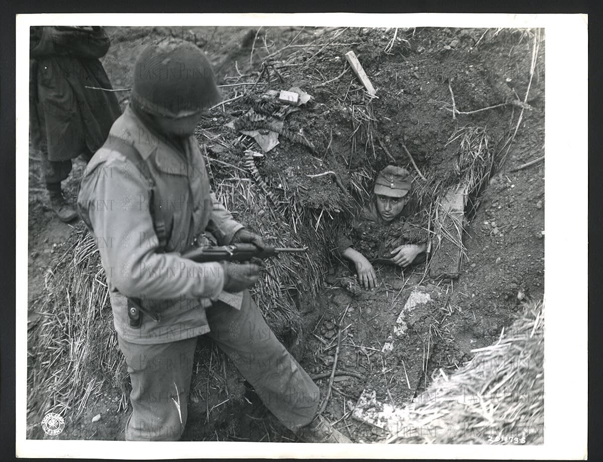 German soldier surrenders to Lt. Roy Rogers "Roger's Rangers”, Linnich, Germany, 1945