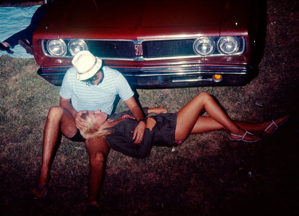 David Burnett, Couple laying in front of car, 1969