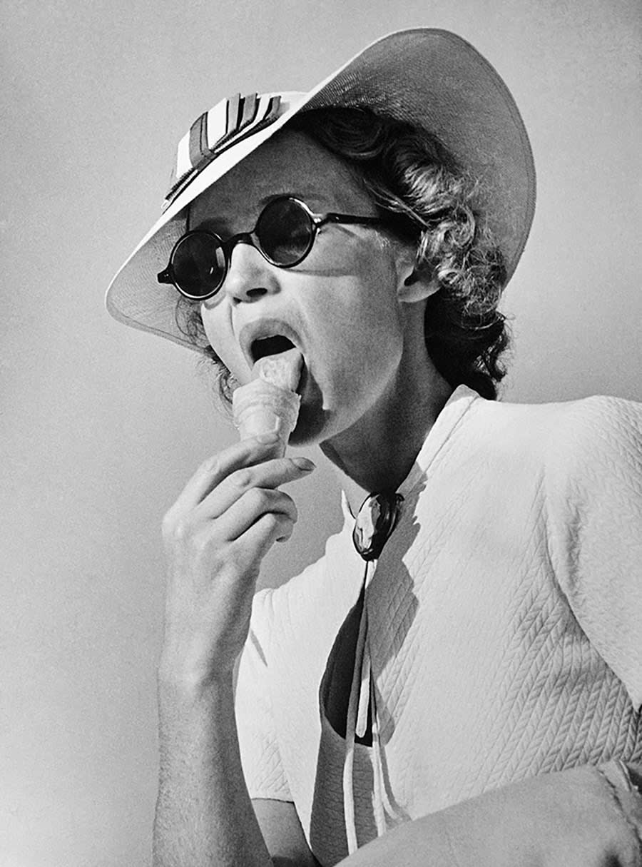 Roger-Viollet, A woman eating ice cream, 1930 circa