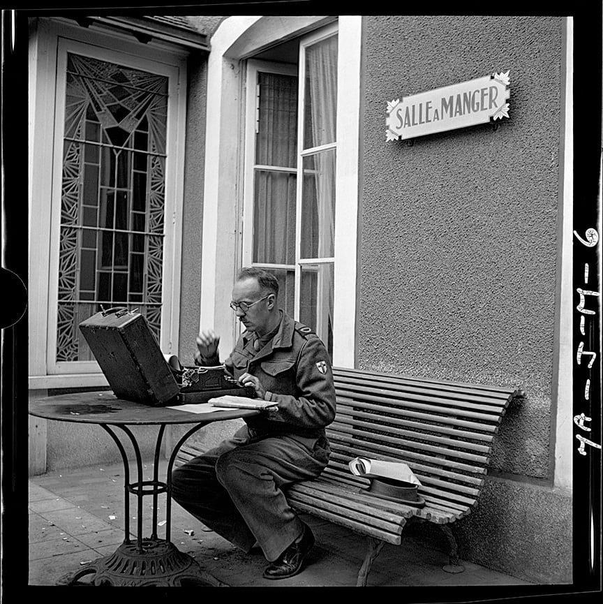 John G. Morris, #8 Bayeux, Calvados, Normandy, July 28: British war correspondent prepares his dispatch at the Hôtel du Lion d’or