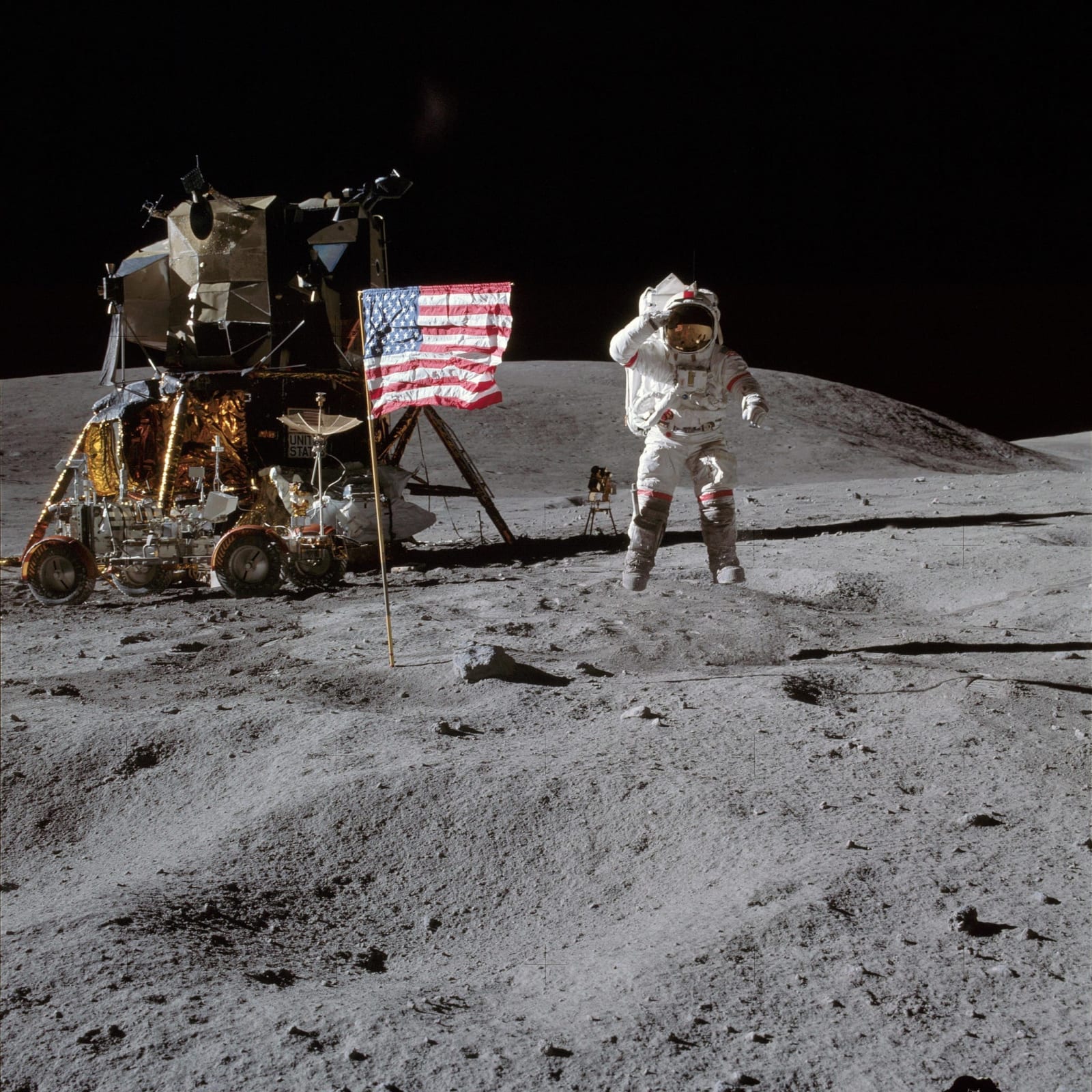 NASA, Astronaut John W. Young, commander of the Apollo 16 lunar landing mission, leaps from the lunar surface as he salutes the United States flag at the Descartes landing site, April 1972