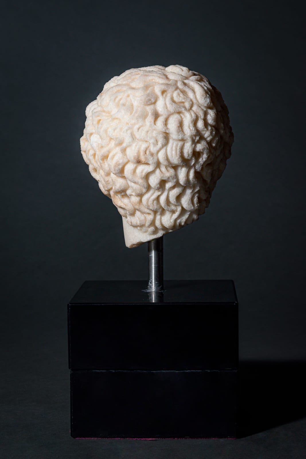 Greek small Marble Head of Ephebe, Ca. 3rd century BC