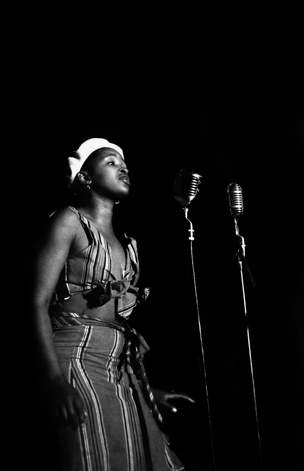 Bob Gosani, Dolly Rathebe singing, c.1955, printed 2025