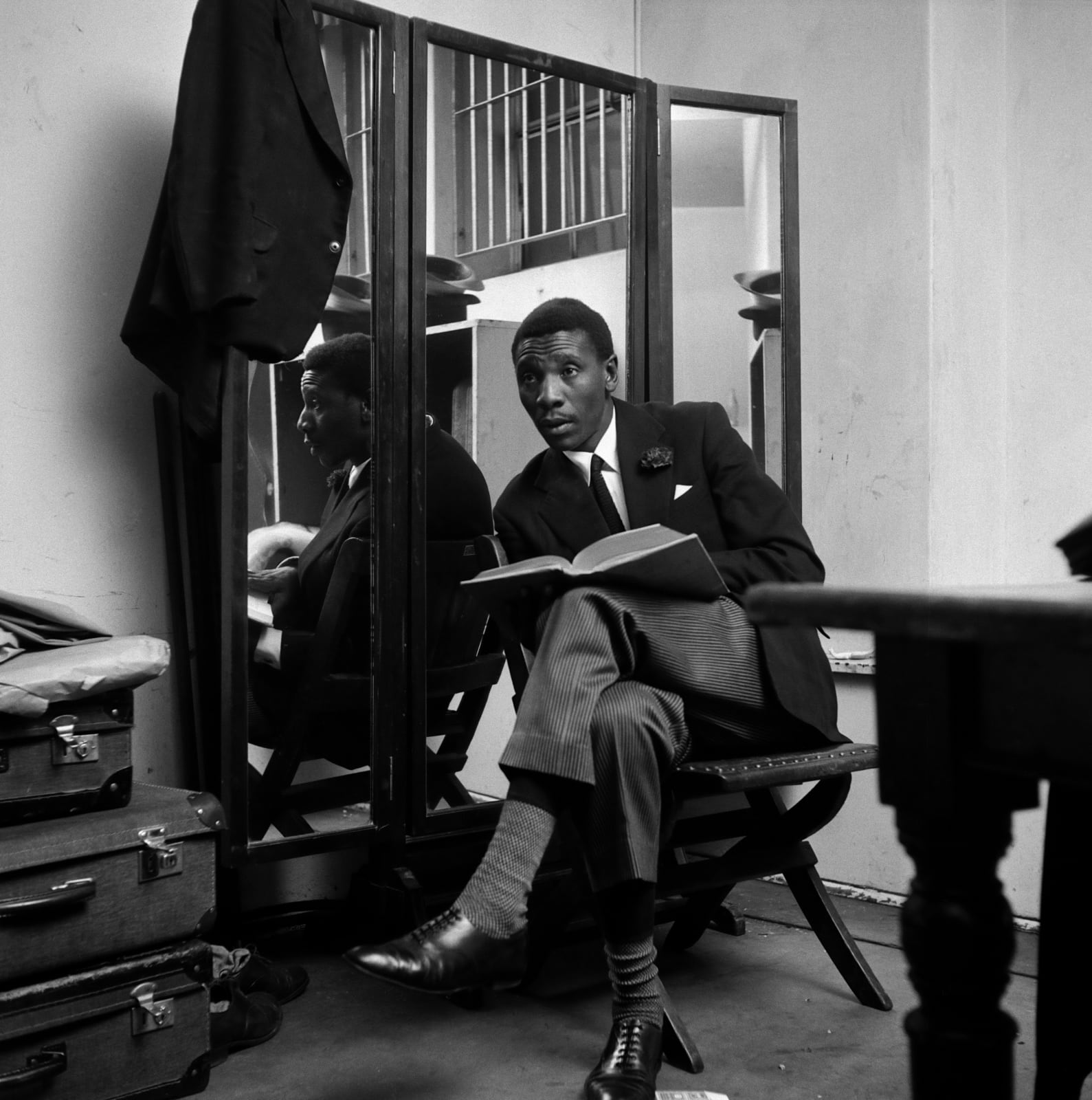 Bob Gosani, Nathan Mdledle reading backstage, Shantytown, Johannesburg City Hall, 1956, printed 2025