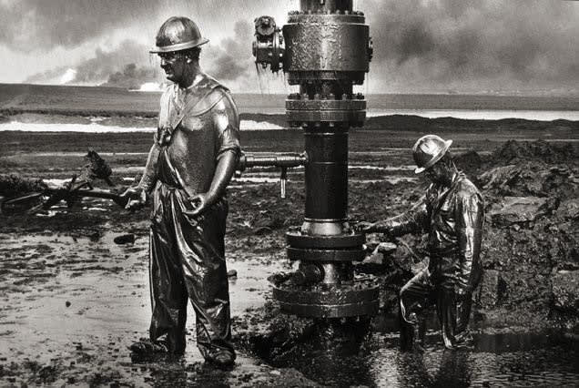 Sebastião Salgado, Workers install a new wellhead to enable the injection of a chemical mud to "kill the old well." Greater Burhan, Kuwait, 1991