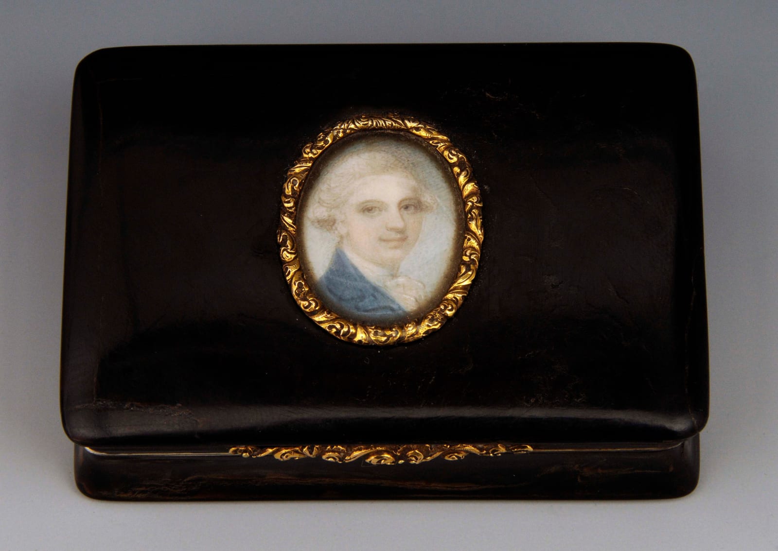 Richard Cosway, Portrait miniature of a Gentleman, wearing blue coat and white shirt with his hair powdered, c. 1780s