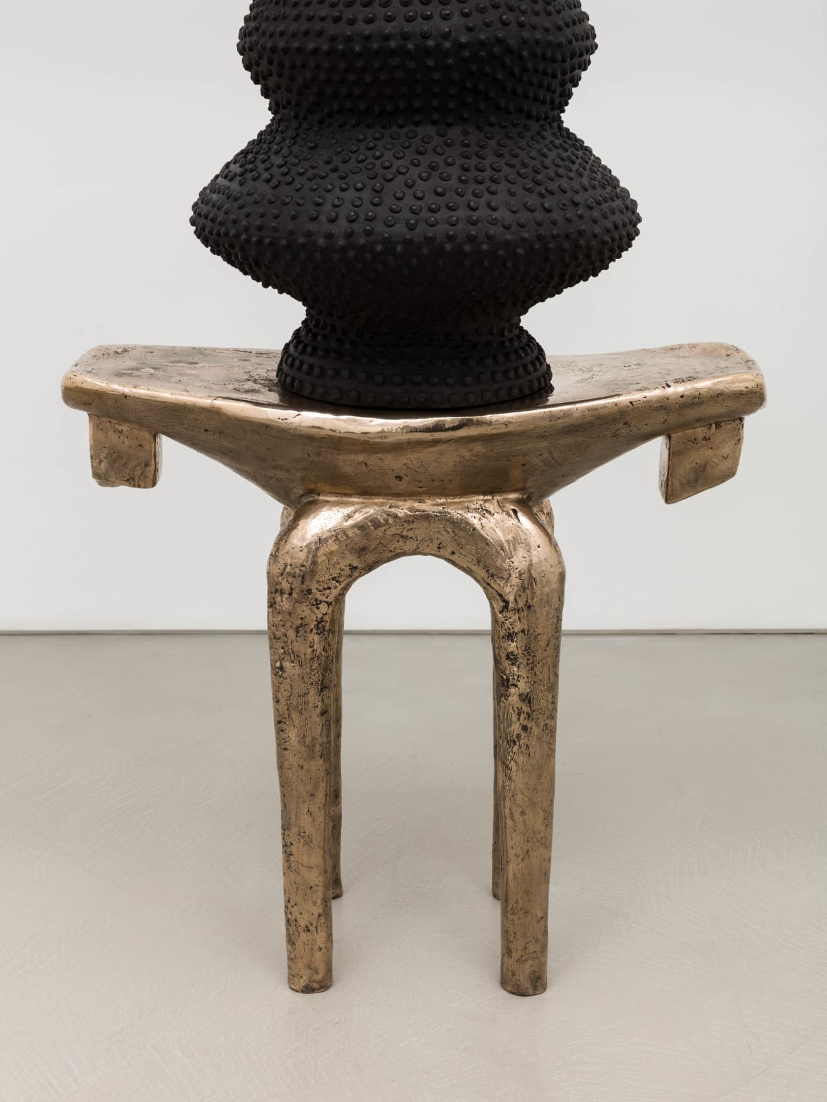 Lina Iris Viktor, black eclipse on golden stool, 2024