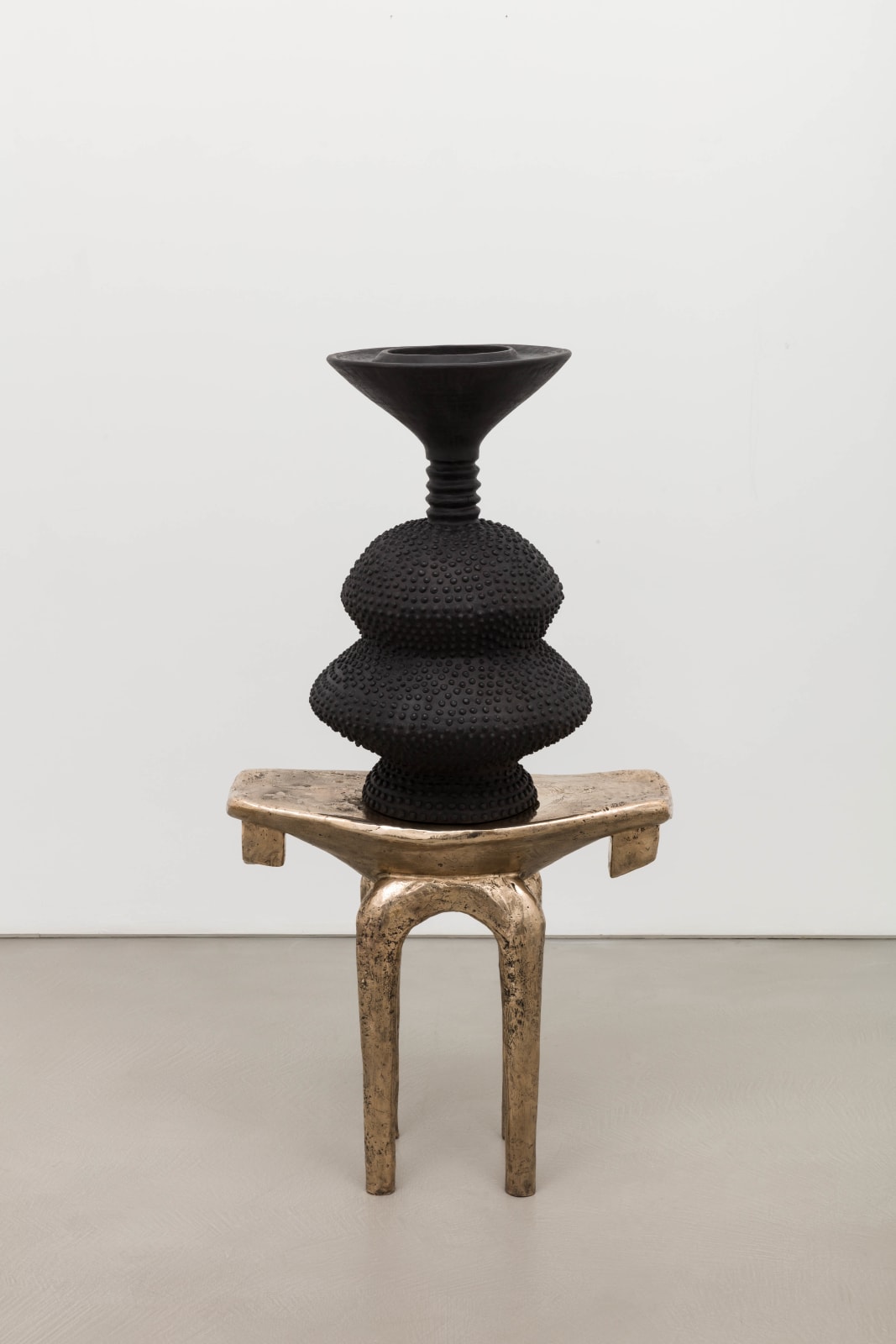 Lina Iris Viktor, black eclipse on golden stool, 2024