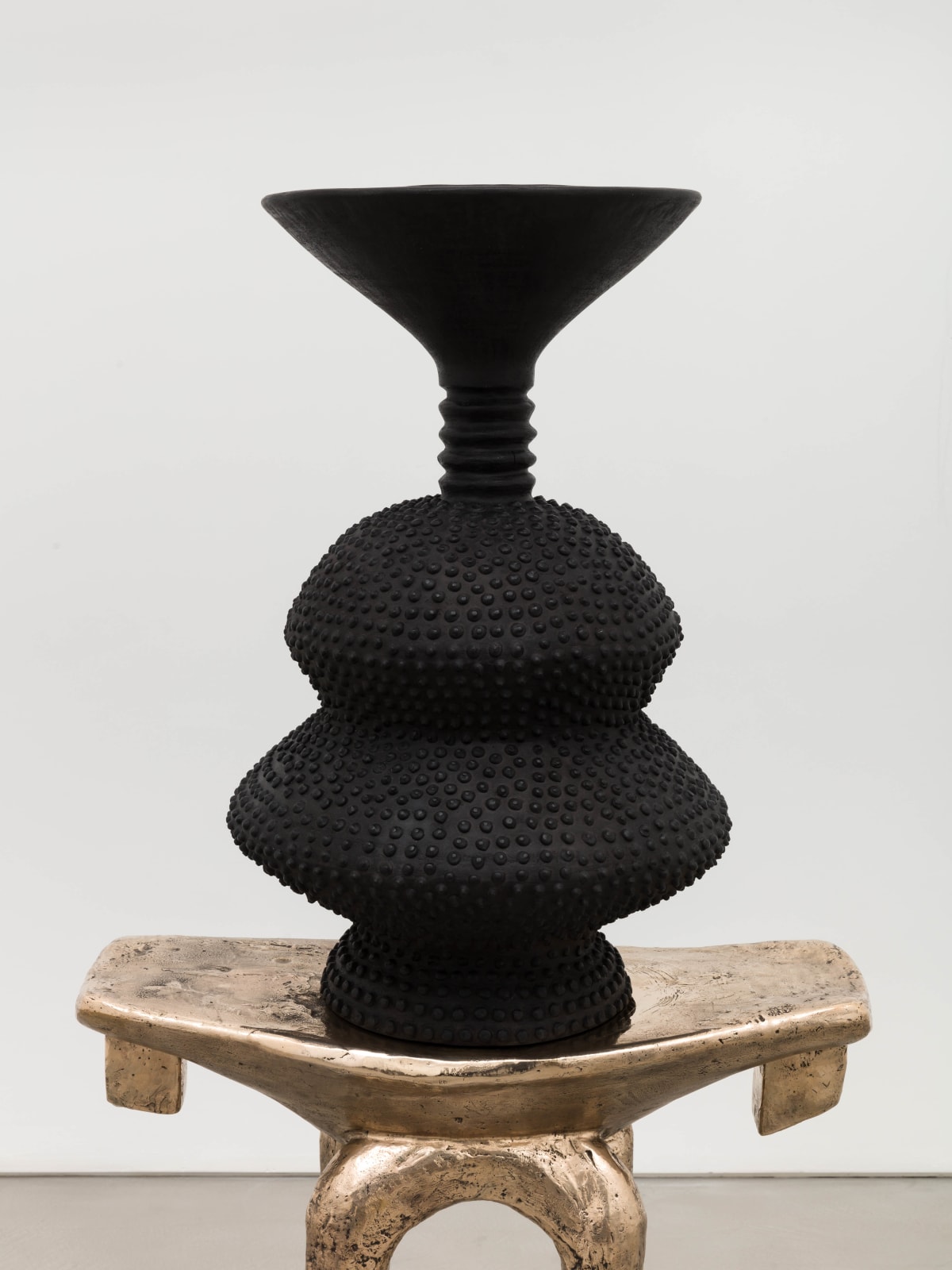 Lina Iris Viktor, black eclipse on golden stool, 2024