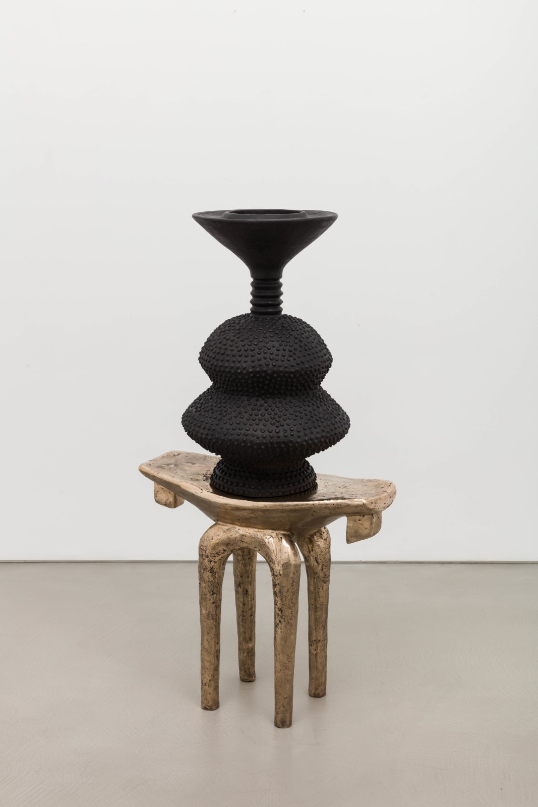 Lina Iris Viktor, black eclipse on golden stool, 2024