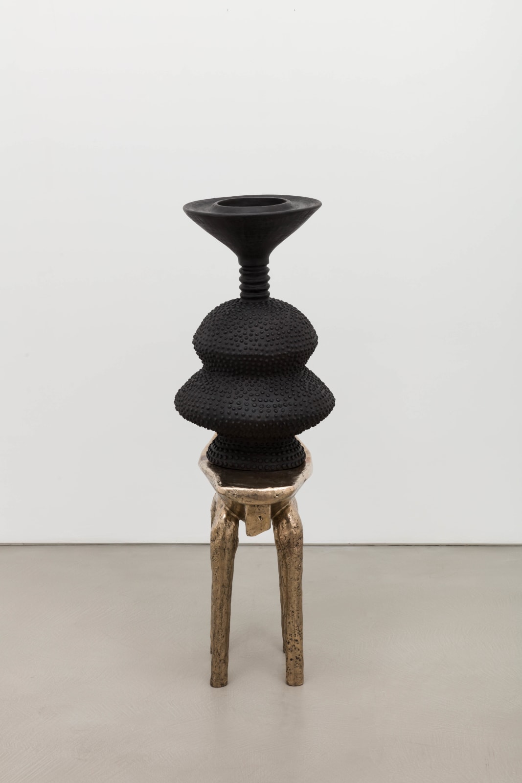 Lina Iris Viktor, black eclipse on golden stool, 2024