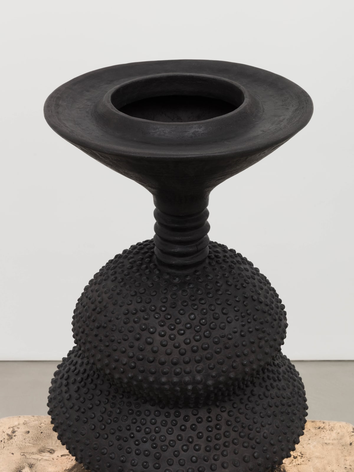 Lina Iris Viktor, black eclipse on golden stool, 2024