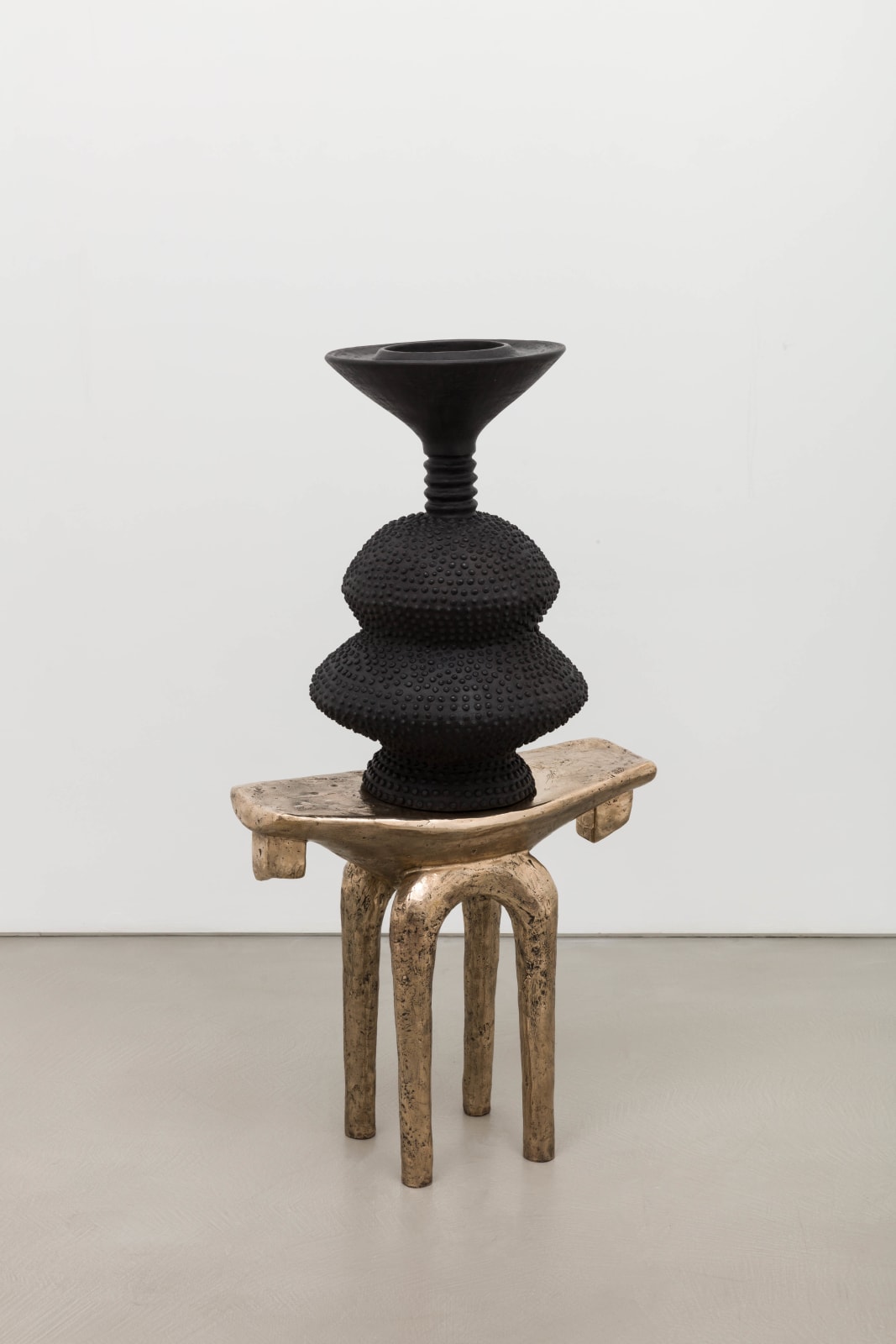 Lina Iris Viktor, black eclipse on golden stool, 2024