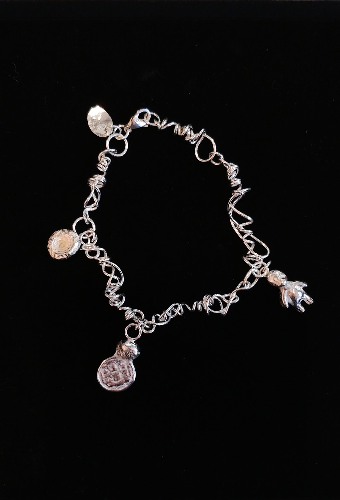 Lucy Coyne, Silver Charm Bracelet with cast found Objects, 2018