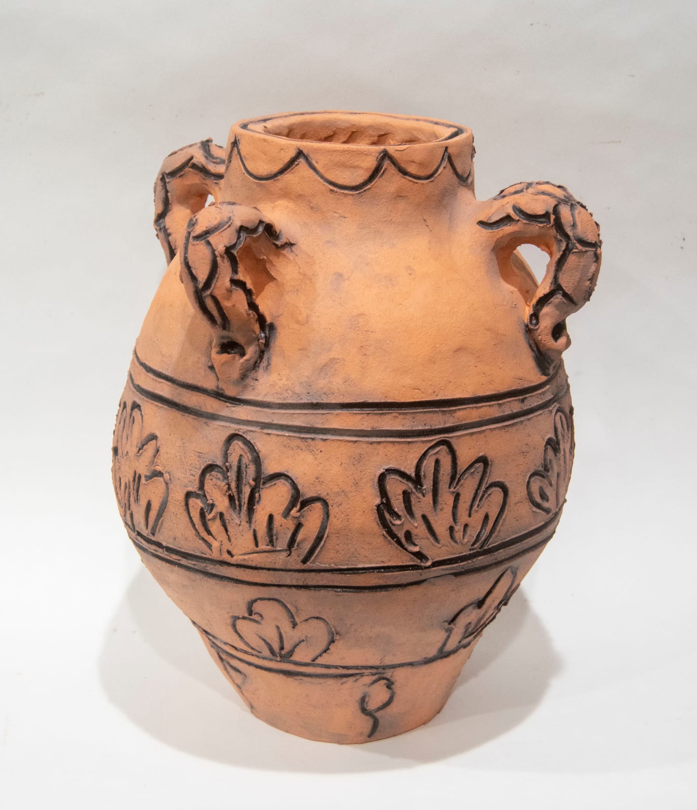 A vase with details debossed and coloured black by artist Reniel Del Rosario.
