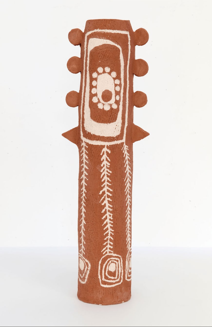 A decorative ceramic Aboriginal pole