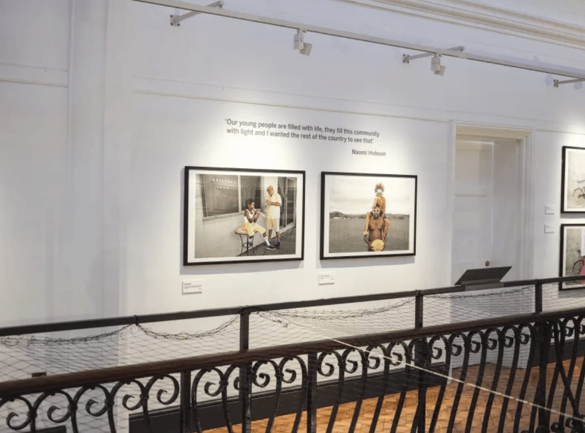 Two Naomi Hobson paintings hanging on a wall at the Horniman Museum