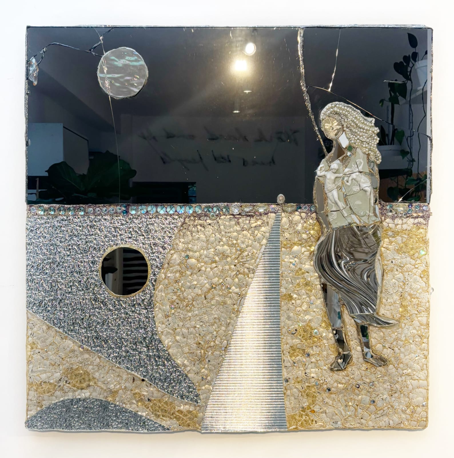 Eccentric British sculptor Andrew Logan's fractured and decorated mirror artwork. The pearl white and silver reflections create a whimsical elegant aura.