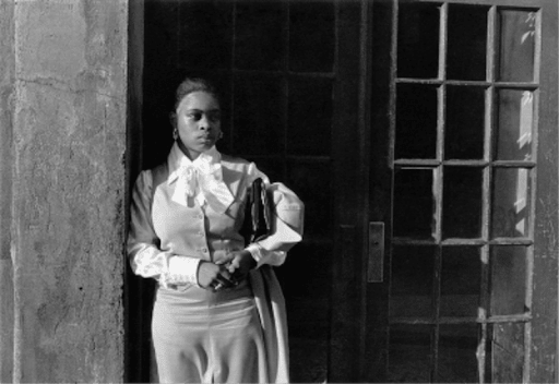 Dawoud Bey, A Woman Waiting in the Doorway, Harlem, NY, 1976