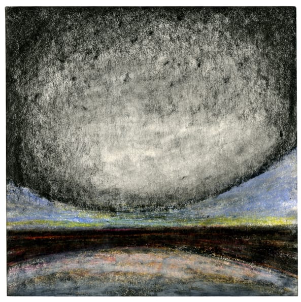 Large white and black round object above a blue and yellow horizon with a black ground.