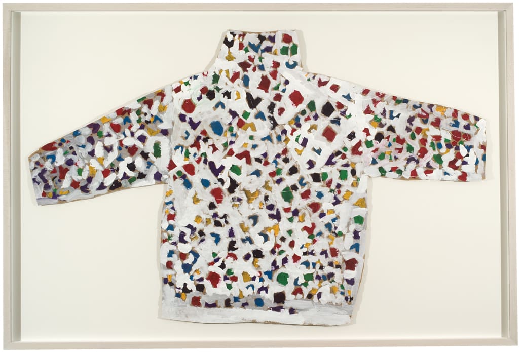 Simple depiction of a white sweater with a colorful red, green, yellow, purple, and blue pattern on it.