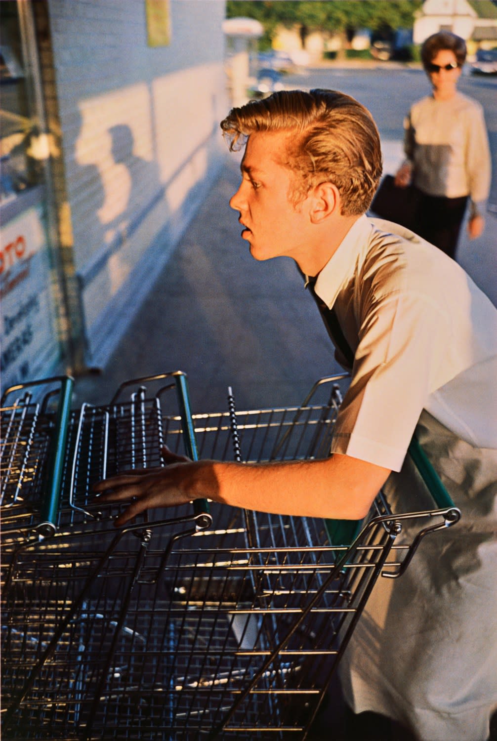 William Eggleston, "TMemphis", 1965 (supermarket boy with carts). From The Los Alamos Portfolio, 2002