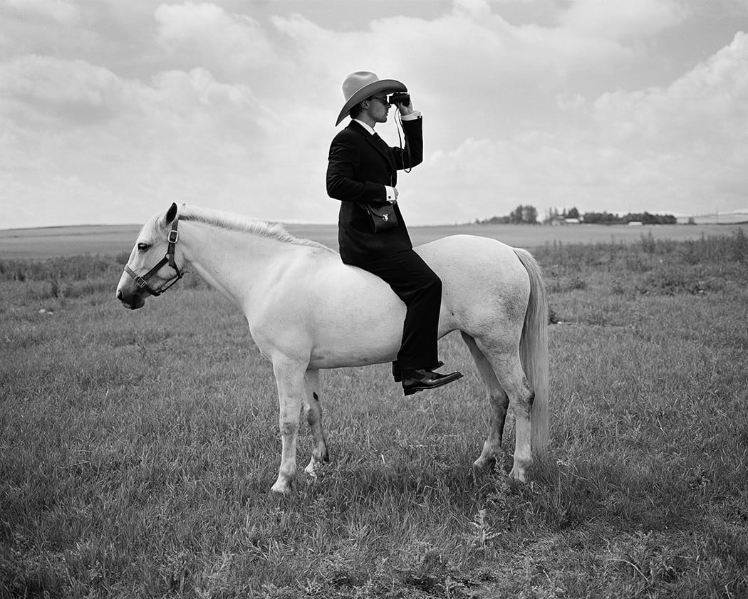 Rodney Smith, Greg Riding Horse Backwards with Binoculars, Alberta, Canada